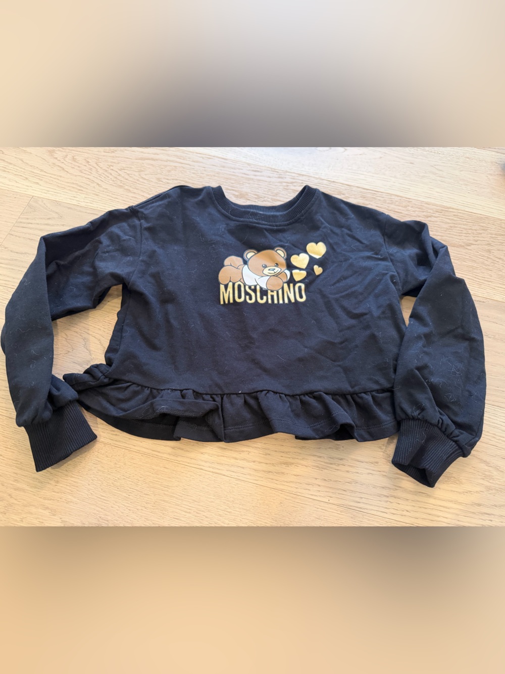 Moschino Black Sweatshirt with Gold Teddy Logo and Ruffle Hem